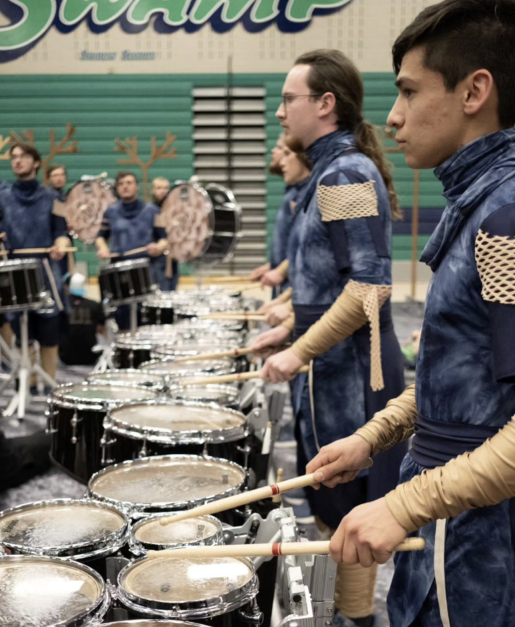 Javier Lopez warms up for the friends and family performance of Blue Knights Percussion Ensemble show “Memento Mori. This was the last run-through of their show before leaving for finals in Dayton, Ohio. (Elizabeth Danekind)