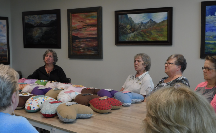 Women of 55 Resort apartments gather and discuss the projects for the upcoming week. Every other week, women from all over the complex come together to stuff, sew and finish the pillows for breast cancer survivors. (Savannah Klemisch)