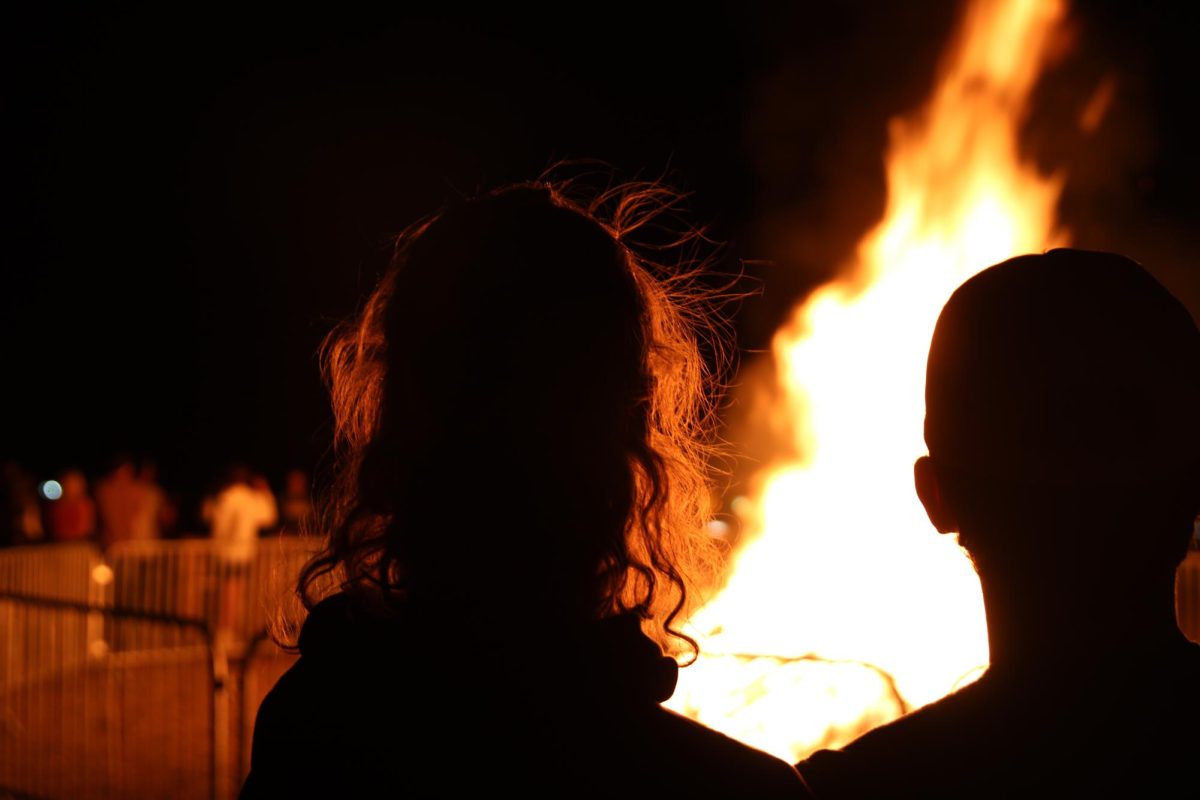 Asher Dunnell (10) and Paxton Magers (10) watch the bonfire from a small distance. The bonfire was Windsor High School’s second and seemed to be greatly enjoyed by all who attended. 