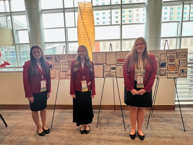 FCCLA members Sonia Miller (10), Lyla Bumford (10) and Ruth Stephens (10) pose at the Colorado Convention Center in Denver last year. The students worked on and presented their Students Taking Action with Recognition (STAR) projects.