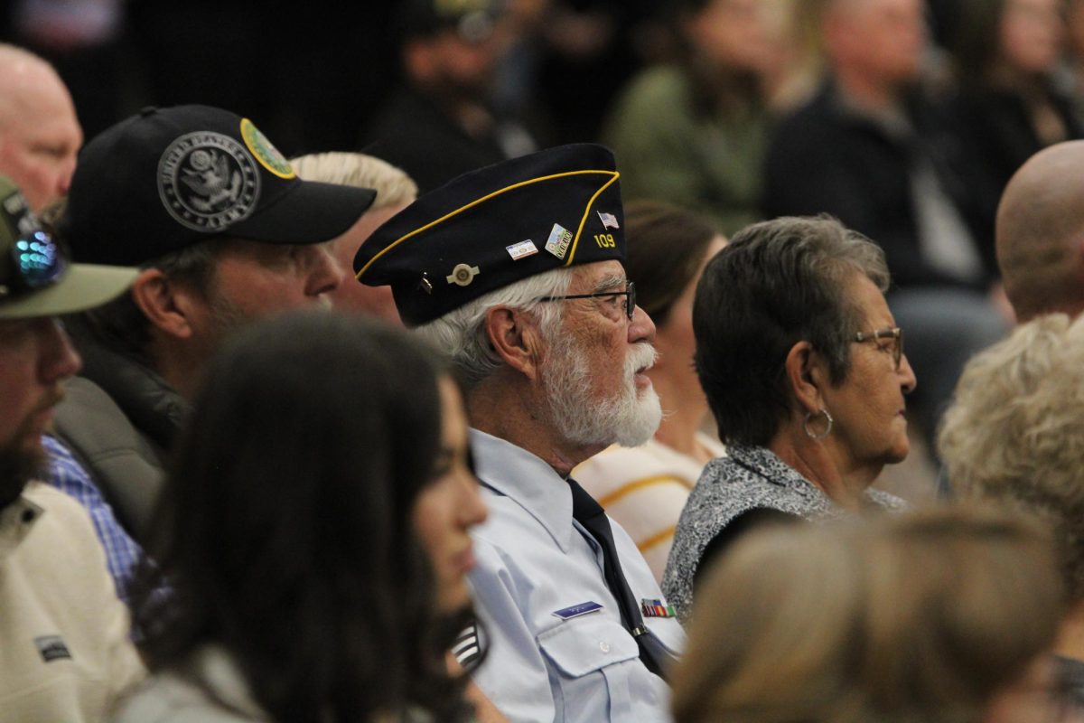 Jim Porth sits in the audience during the Veterans Day assembly on Nov. 10, 2023. He attends the assembly every year.