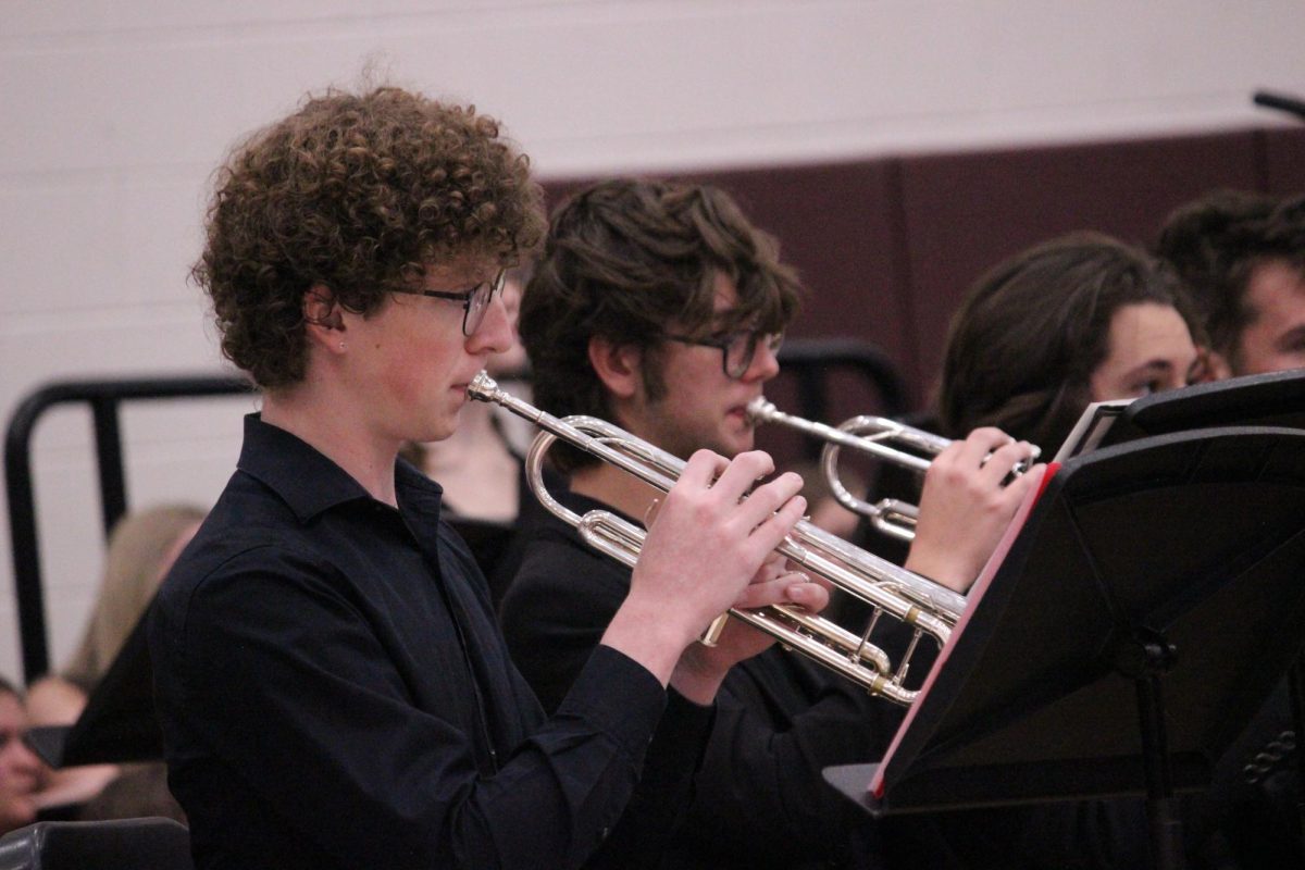 Hunter Crow (12) plays the trumpet alongside Cole Cooper (12). Most of the songs performed were combined with instruments and voices, but each department also had a song for themselves.