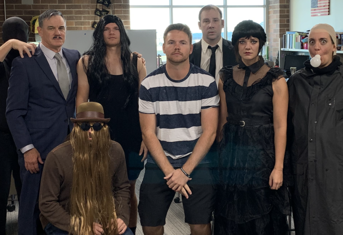 The+math+department+at+WHS+poses+for+a+picture.+They+dressed+up+as+the+Addams+family+and+took+first+place+in+the+contest.+