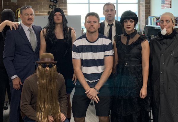 The math department at WHS poses for a picture. They dressed up as the Addams family and took first place in the contest. 