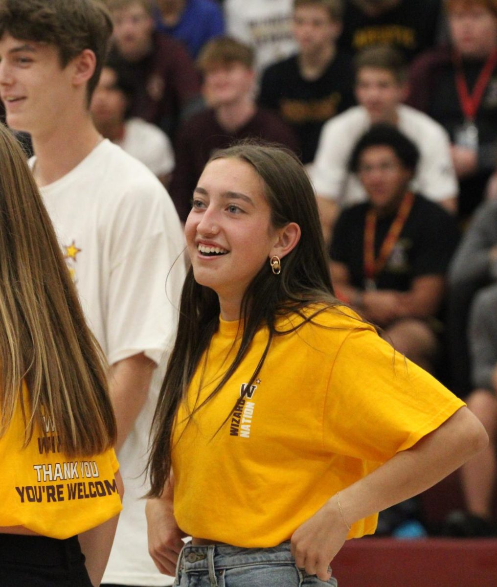 Leah Bacon smiles while working with Student Council during the homecoming week assembly. SECOND SENTENCE NEEDED.