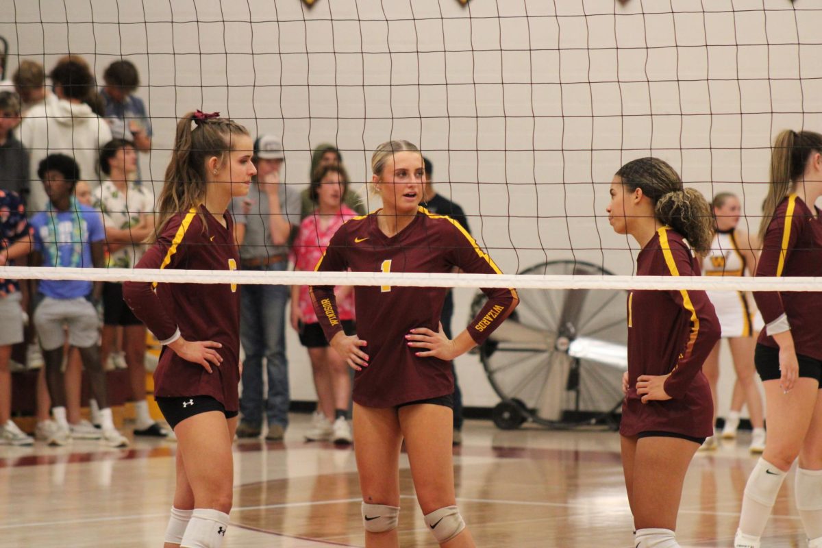 Julia Bohlinger (12) and her teammates discuss their next play. Coaches have said that teamwork is one of Bohlingers strongest attributes.  