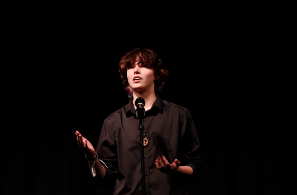 Kian VanBibber (09) recites Always Something More Beautiful by Stephan Dunn at the WHS Poetry Out Loud competition on Feb. 7. VanBibber placed third in the competition overall.