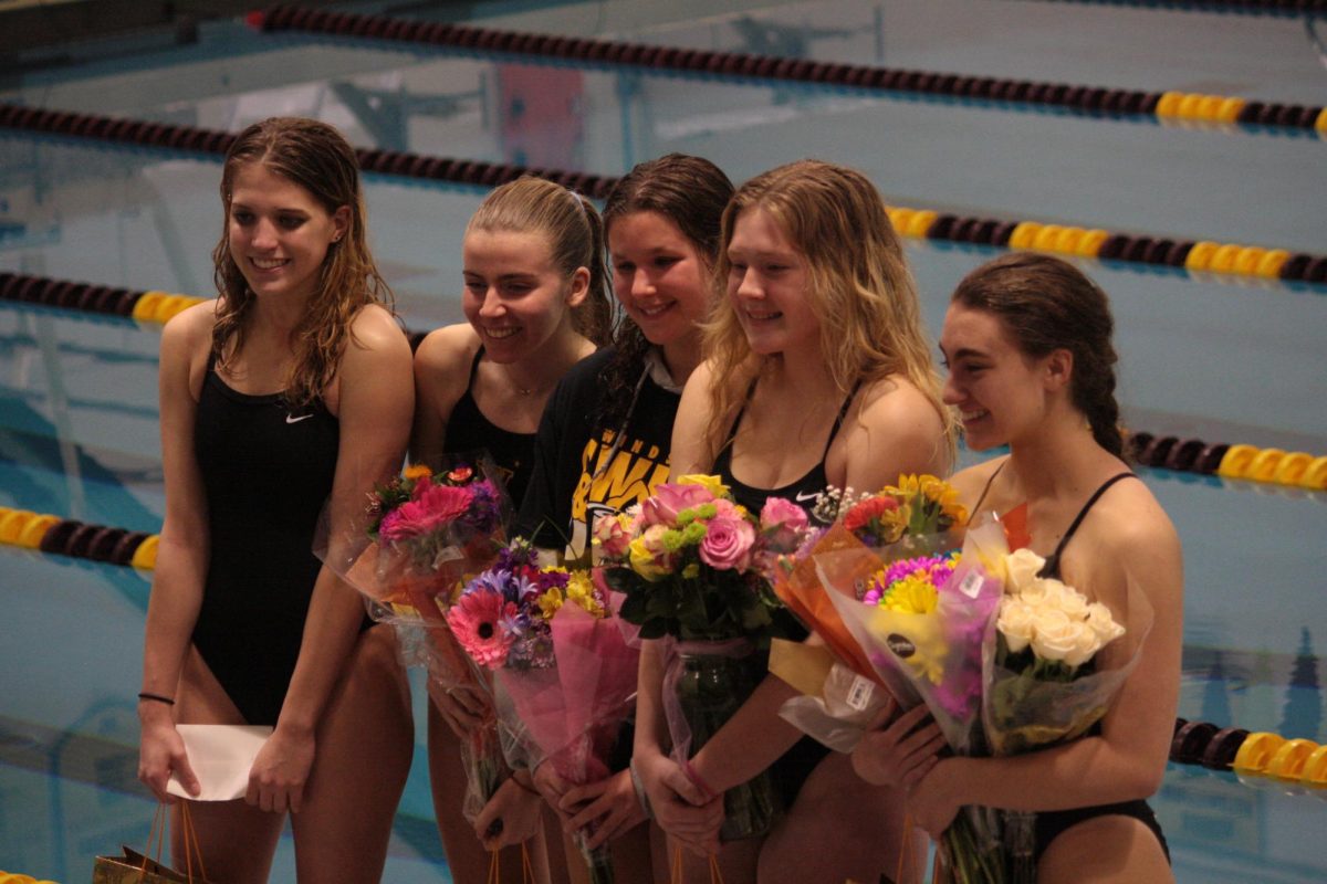 The girls swim team celebrates their seniors last meet at home, recognizing their accomplishments through their career and announcing their plans for the future. Senior night was on Jan. 18, shortly before the conference meet. Ellie Sedaghat (12) said, Four years for these four minutes — it was worth it! My friends and family from both teams were there and it was like all my worlds came together that night.