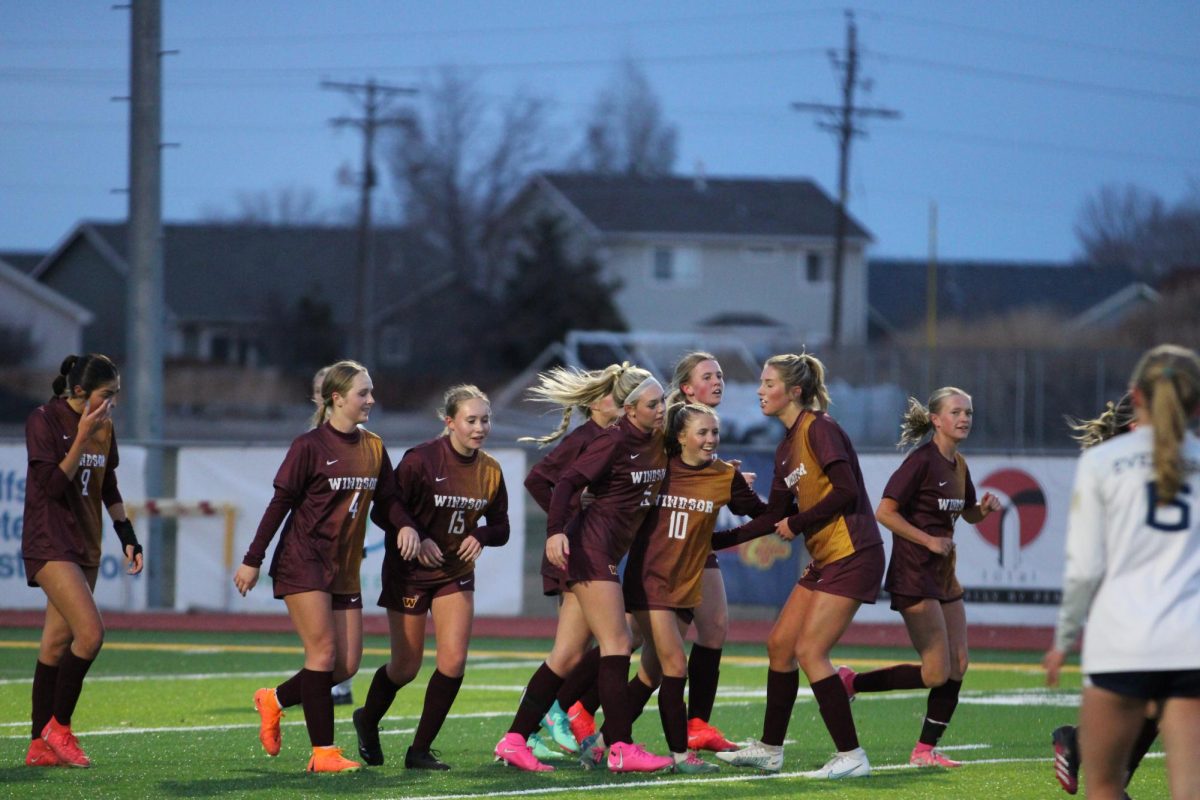 The team celebrates after Tatum Gentry (09) scores a goal against Evergreen High School on March 26, 2024. With five goals, Gentry is tied with Braely Martinez (10) for the teams top goal scorer.