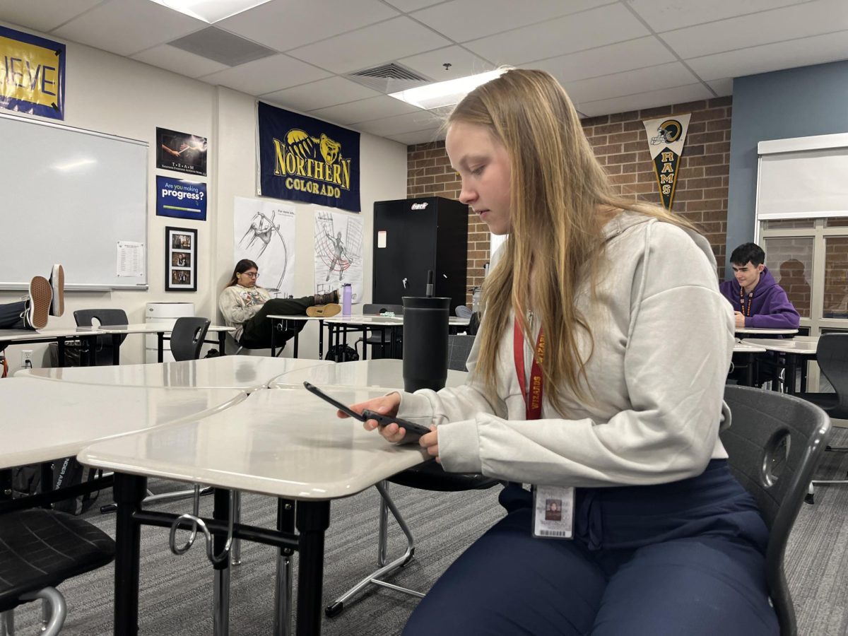 Taylor Royse (11) texts her friends on her flip phone in advisory class. Royse switched to a flip phone to escape from the addictive feelings social media gave her.