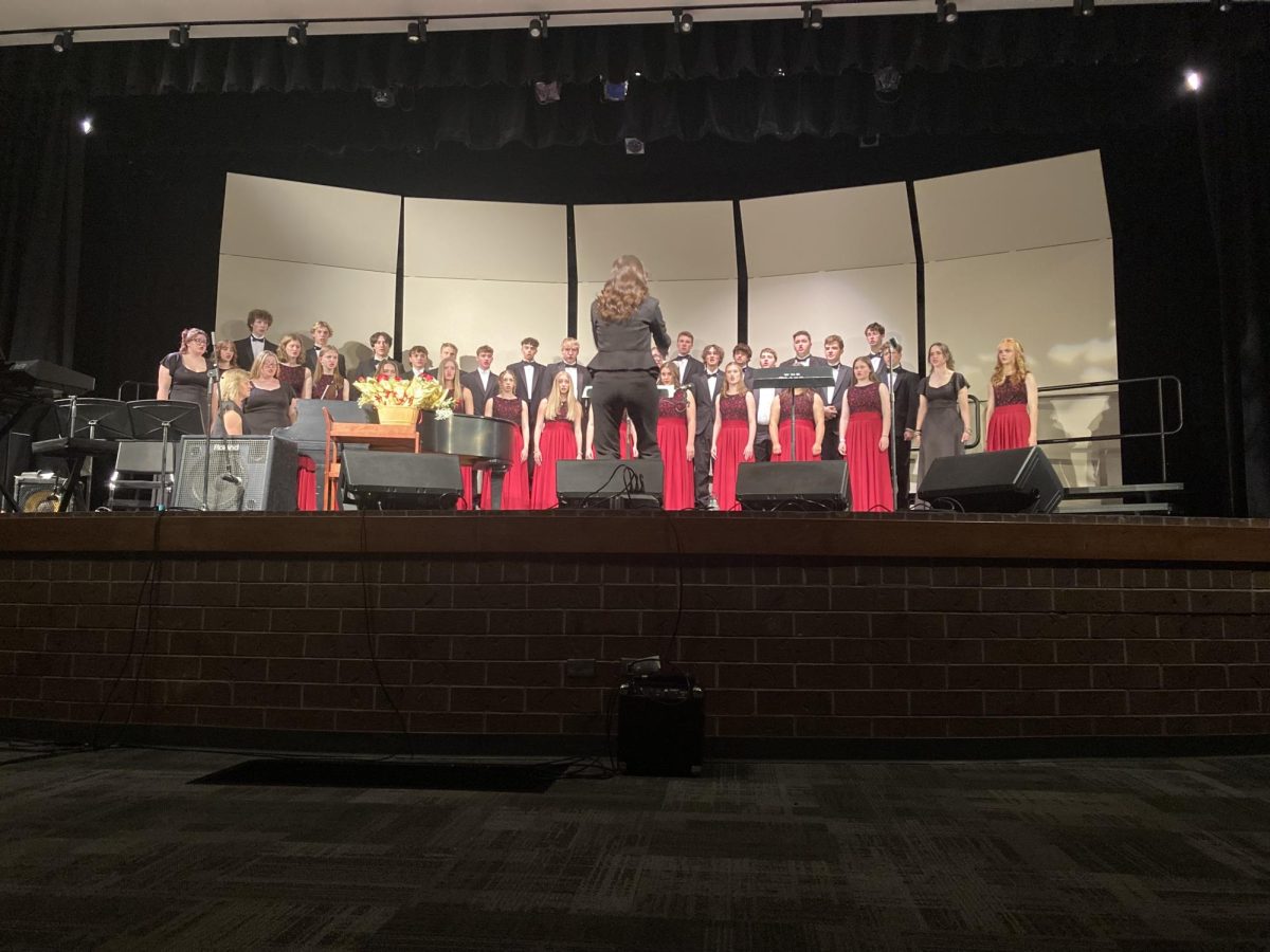 Director of choirs Amy Murphy (staff) conducts concert choir for the last concert of the year. Murphy has had a profound effect on the choir program over the past four years.