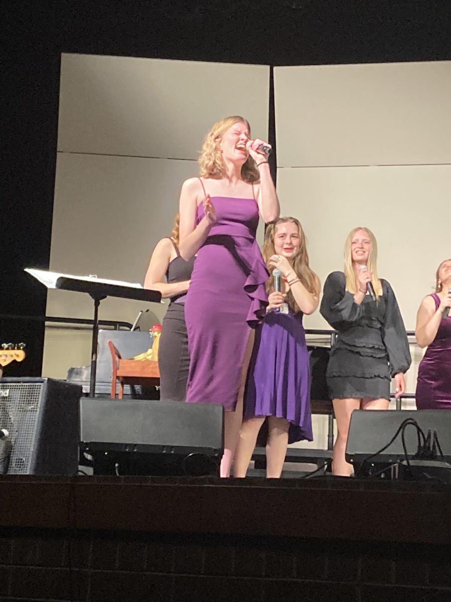 Alex Rood (11) sings her solo during the Wizardry song Black Hole Sun. Rood has participated in choir for all three years of high school so far.