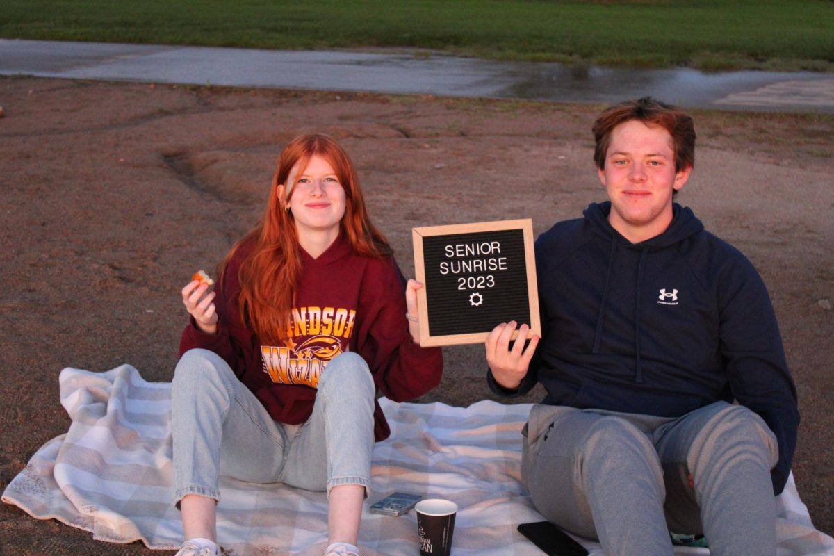 Shannon Cooney (12) and Peter Toms (12) smile for their first and last senior sunrise. Graduation is on Sunday, May 26, at Blue Arena.