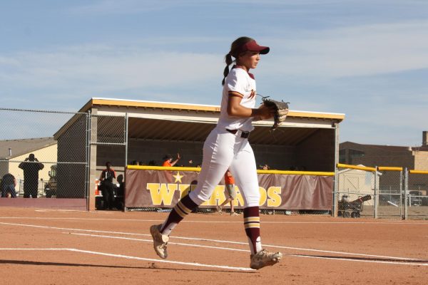Lindsey Hinson (11) prepares for a play during a softball game. This game was won by the wizards against Fossil Ridge. 
