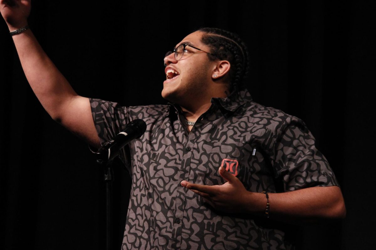 Rize Simmons (11) performs with emotion that moves the crowd in the 2024 school Poetry Out Loud competition. This poem — The Song of the Smoke by W. E. B. Du Bois — was his favorite recitation out of the three he prepared for nationals.