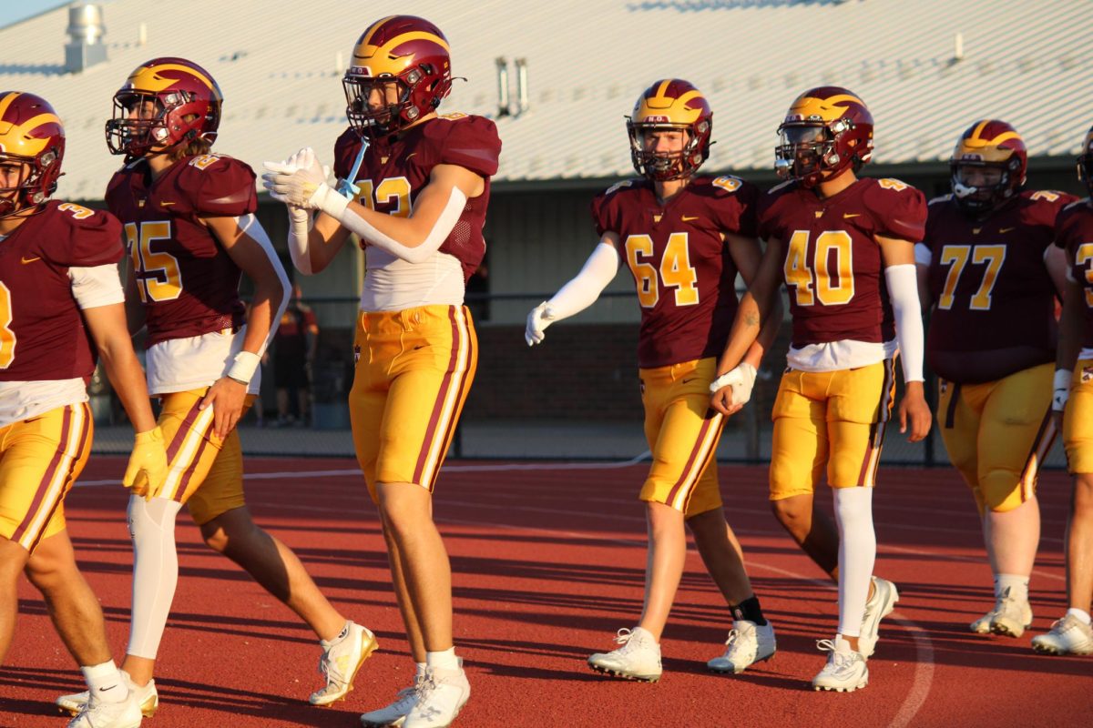 The football team of WHS steps onto the field for their first game of the season against Green Mountain on Thursday, Aug. 29. The final score was 13-19, with the Wizards taking a loss.