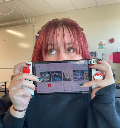 Avis Skinner (12) shows off her Nintendo Switch games. There are a few games on her console, such as "What Remains of Edith Finch," "Don't Starve" and "Moon Hunters."