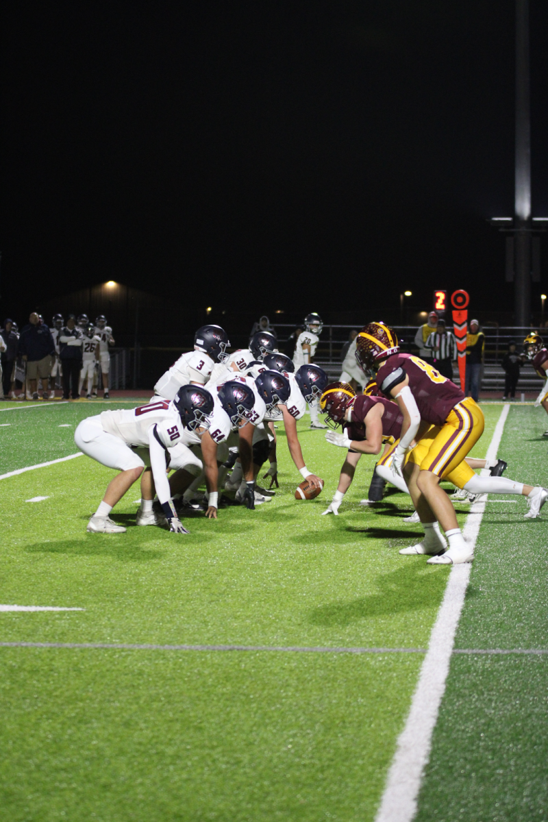 The defensive side for the Wizards works hard to keep Northridge from scoring a touchdown. The Wizards dominated Northridge 45-6 in the homecoming game.