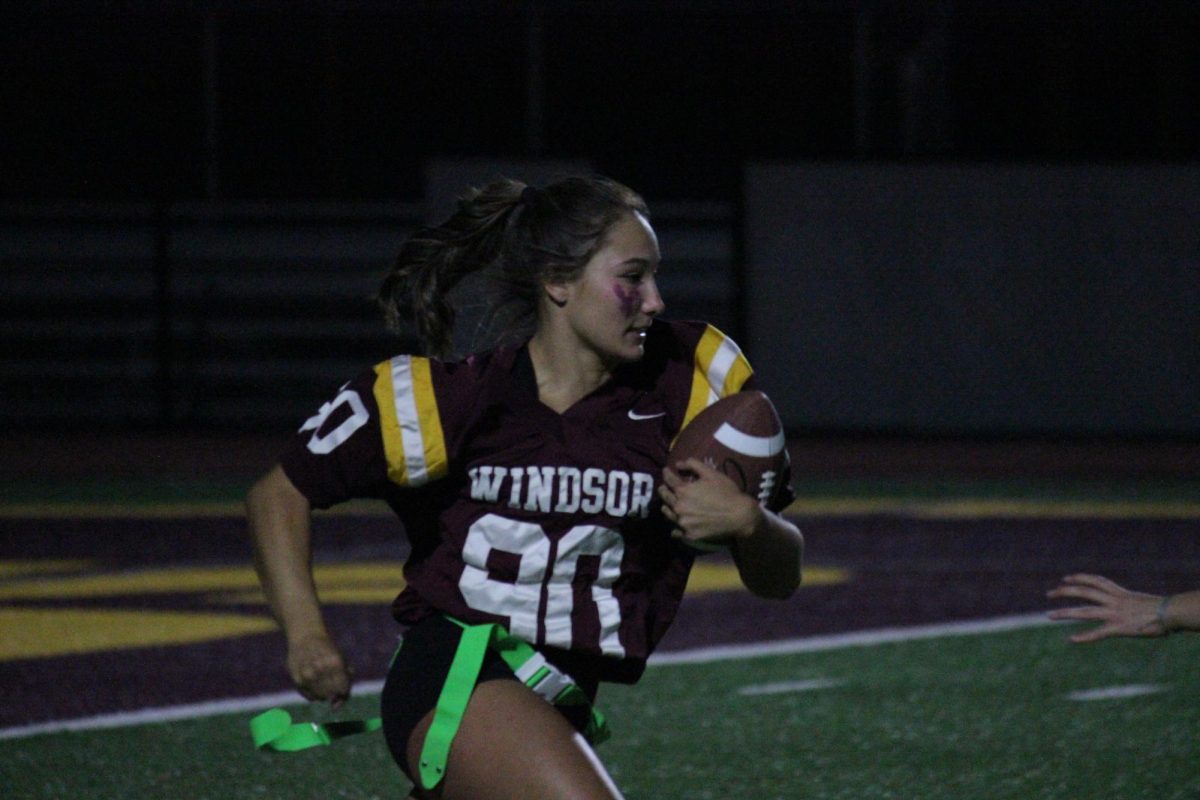 Madilynn Romme (12) plays powder puff football to show support during the events homecoming week. The game seemed to be a success as a lot of people showed up and cheered the girls on.   