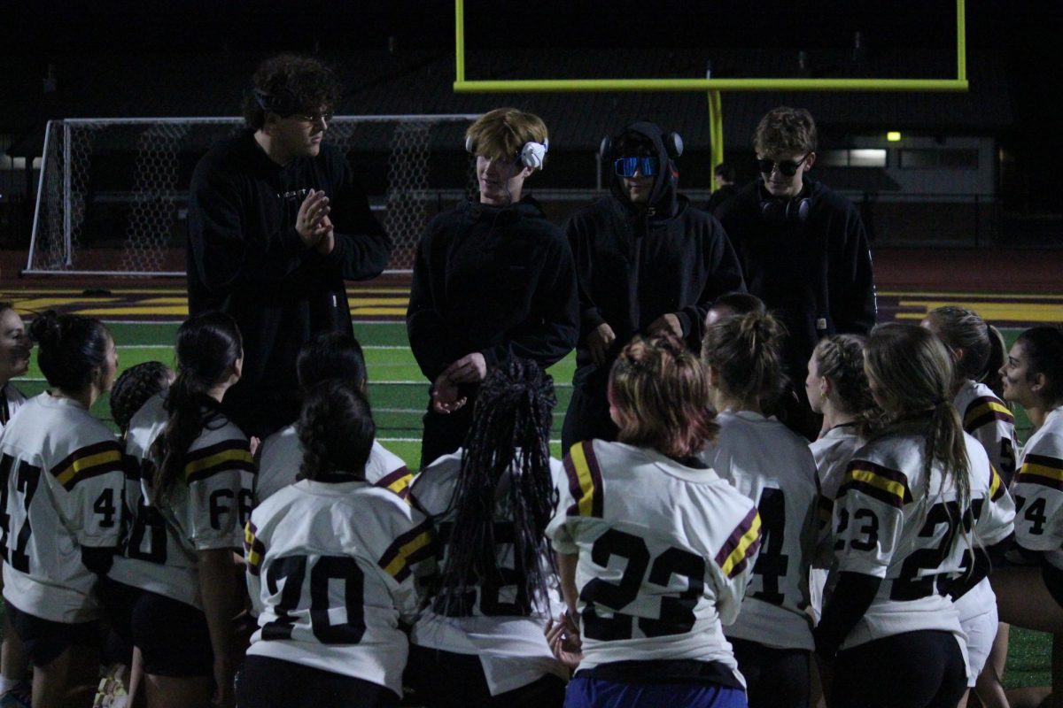 Junior coahces and players give three claps to the opposing seniors for a well fought game. The juniors defeated the seniors with two points to spare. 