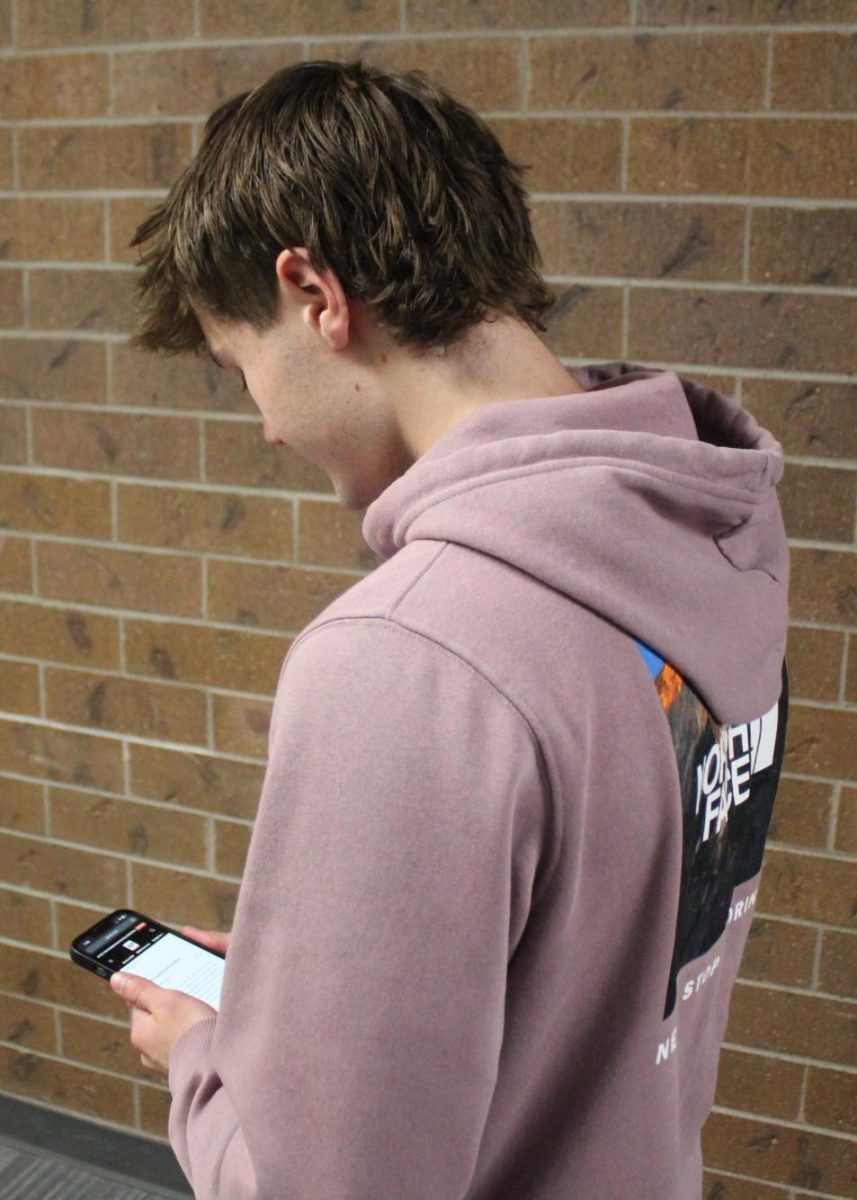 Blake McComack (12) browses the AP News election page. McComack doesn't like how social media algorithms can skew political information. 