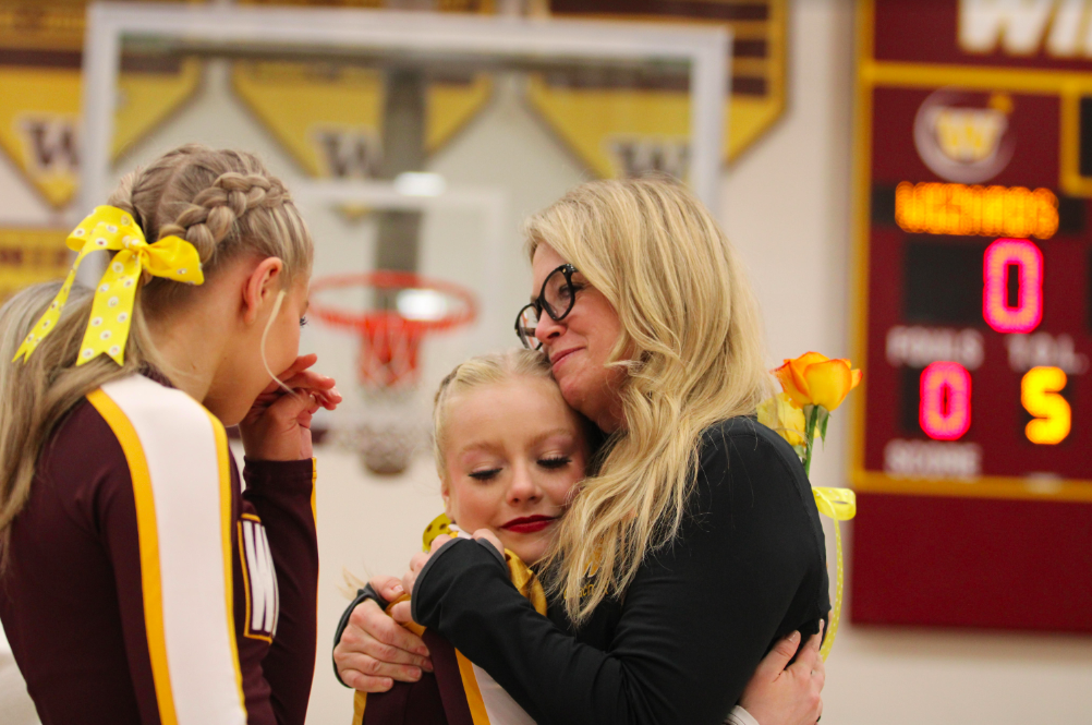 Cheerleading coach Liz Kampschroeder says goodbye to former cheerleader Hailey Andreason ('24). The cheerleading team feels more prepared for this school year as Kampschroeder has settled into this role.