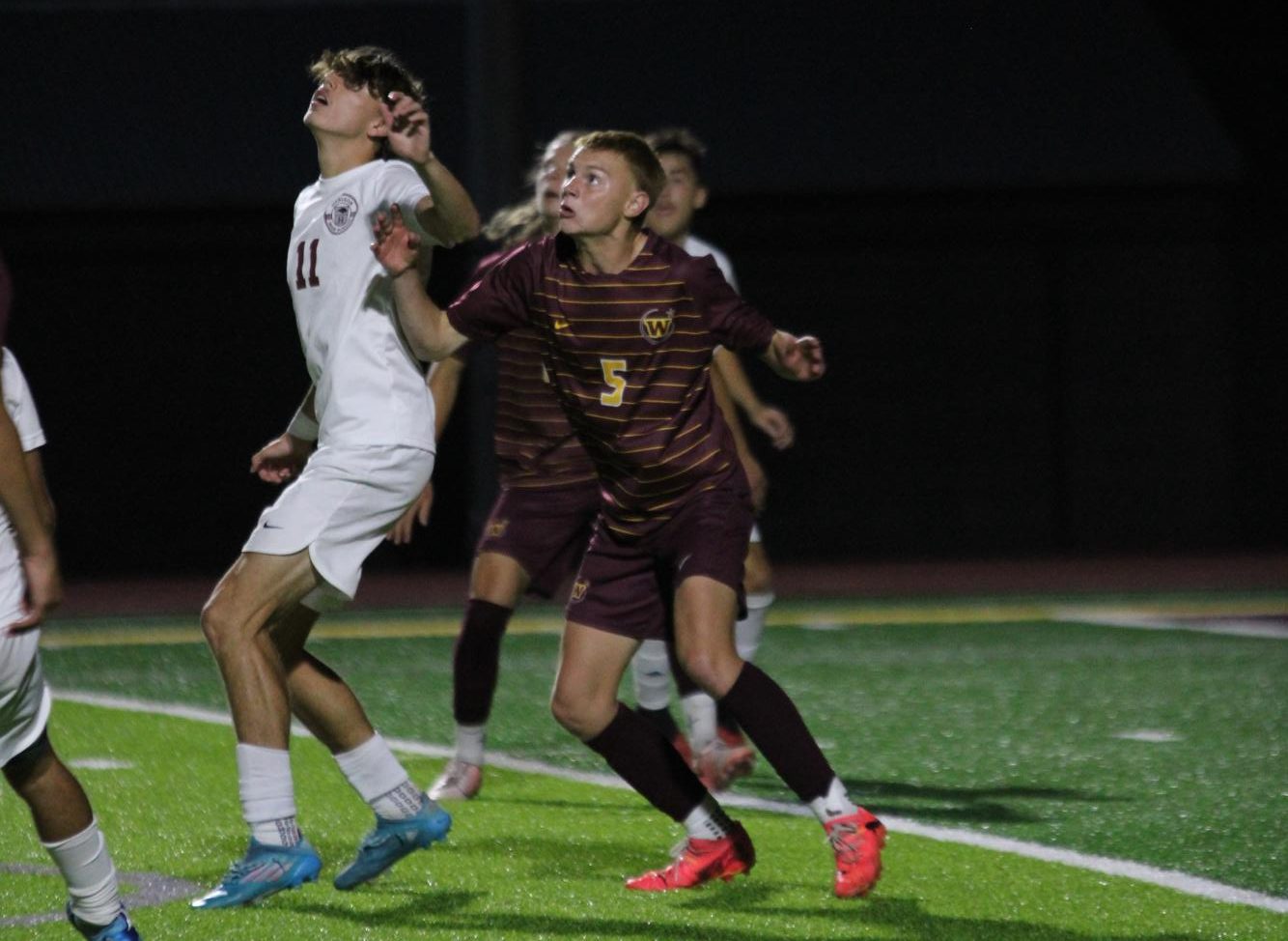 Michael Webb (12) defends Horizon High School's striker on a header. Webb was a starting center back for the varsity soccer team his senior year and recently enlisted in the United States Navy.