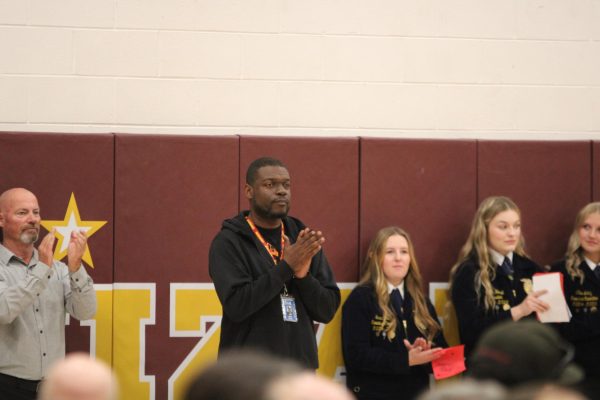 Staff member is honored during veteran's day assembly