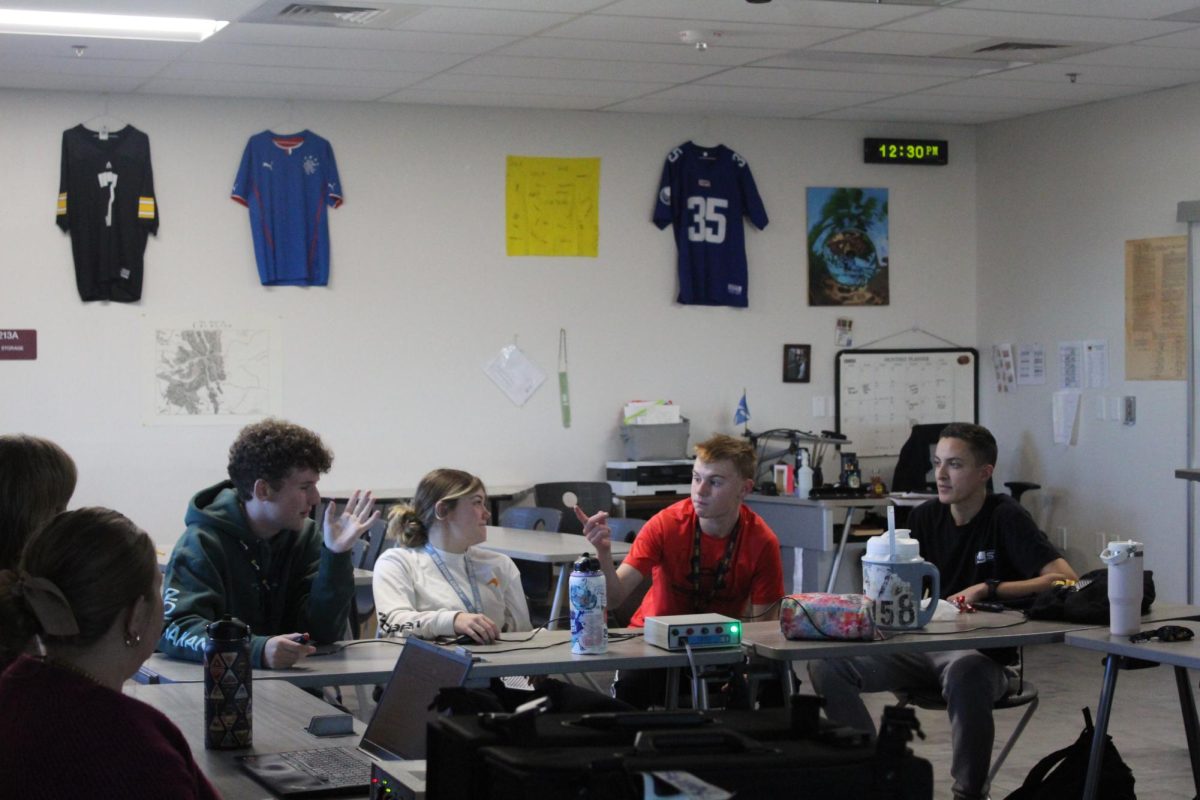 Layne Tometich (12), Delaney Kintz (12), Michael Webb (12) and Adam Kirkpatrick (12) practice for the Jan. 18 Knowledge Bowl meet. Kintz, Webb and Kirkpatrick have all participated in Knowledge Bowl before; this is Tometich's first year.