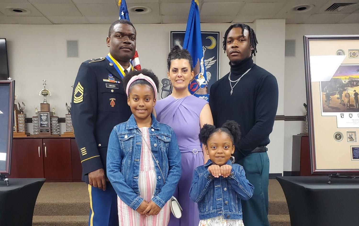 Willie Brown (staff) and his family pose for a picture after the retirement ceremony in May 2024. Brown served 26 years in the military. (Provided Willie Brown)