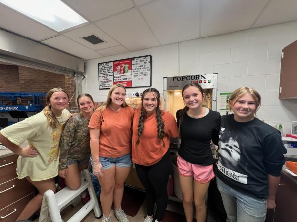 six FCCLA members pose in the concessions stand area