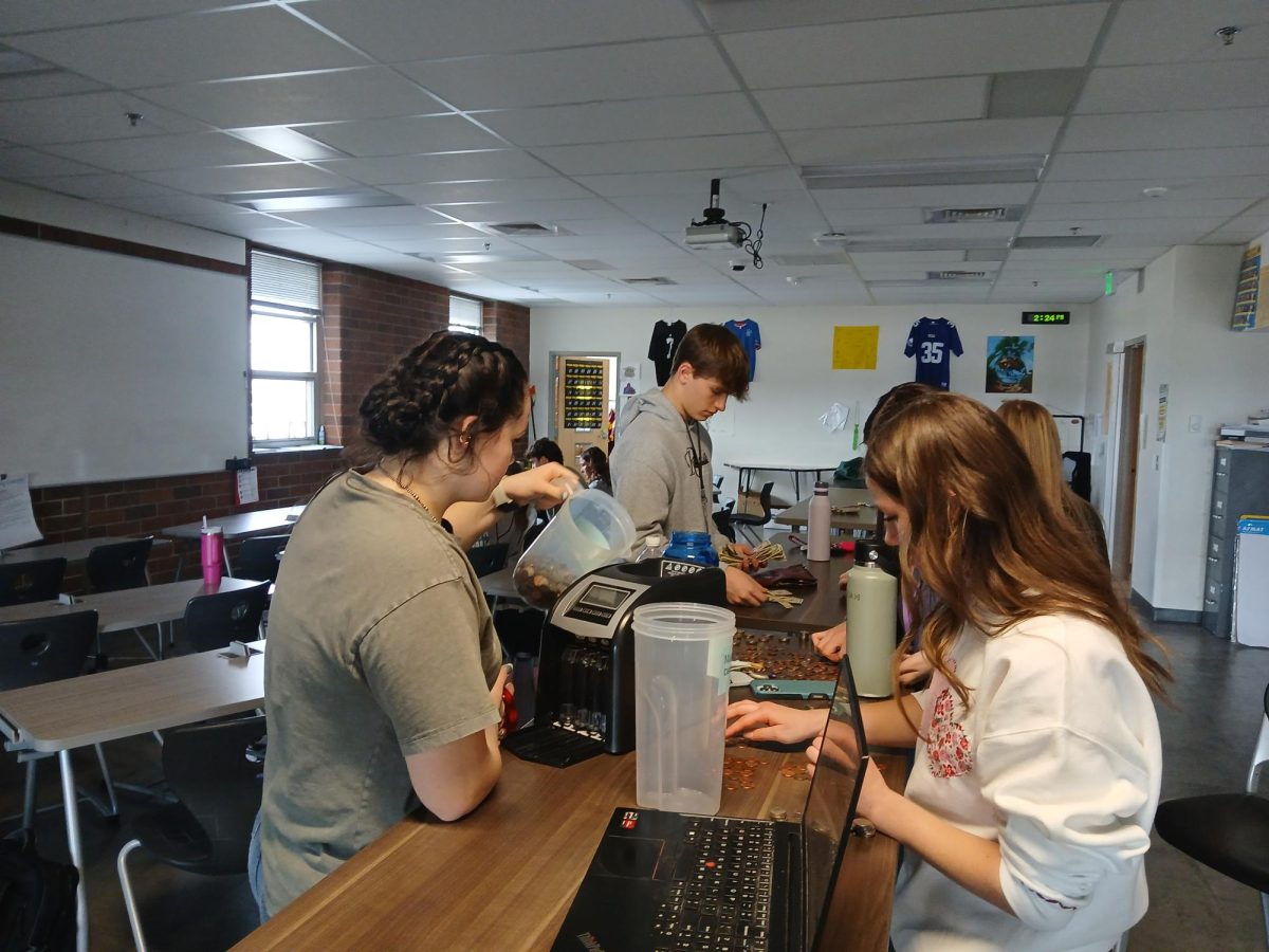 Student Council members count change for Change Wars. Change Wars took place from Feb. 10 to Feb. 21 in advisory classes to raise money for Make-A-Wish.