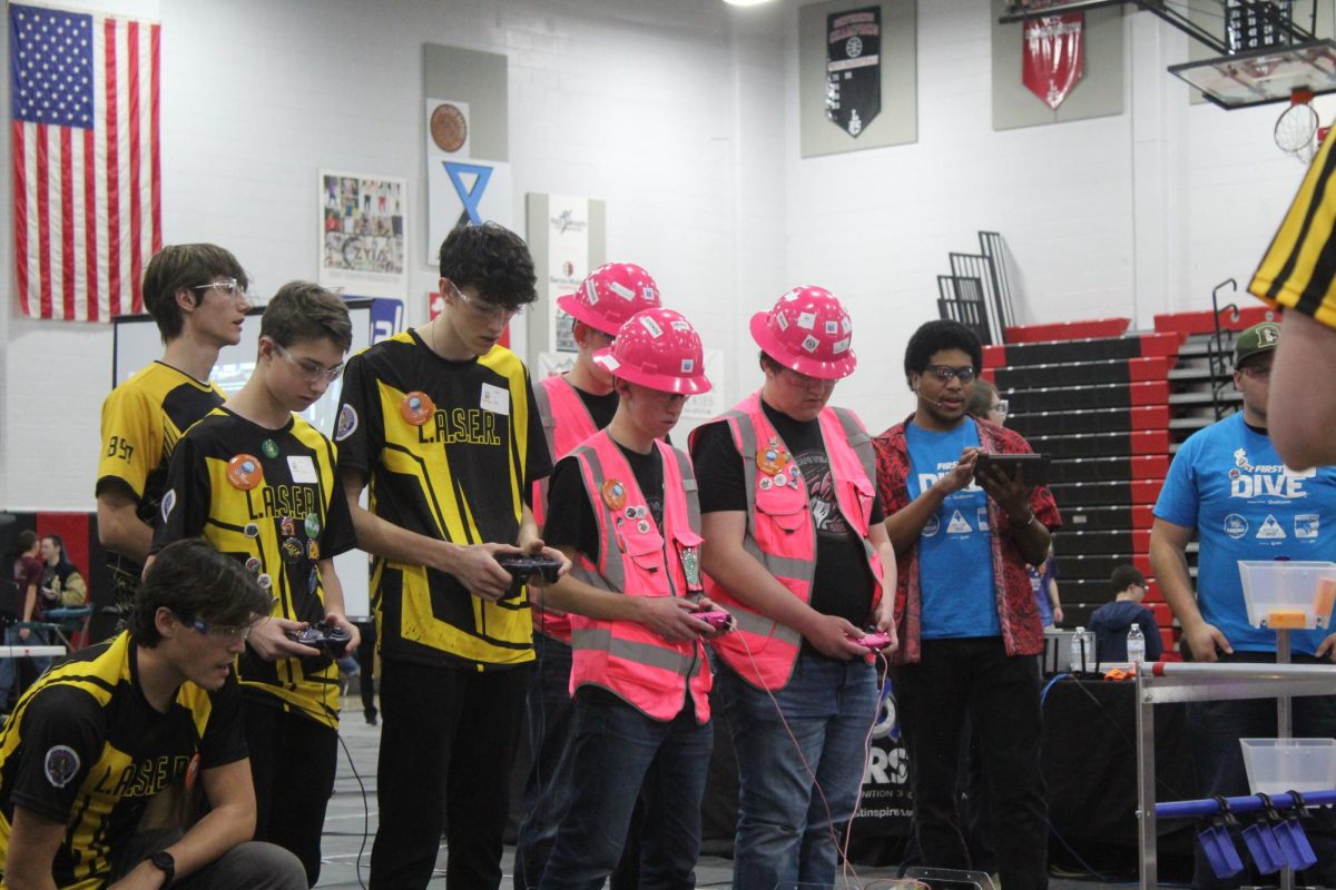 Teams L.A.Z.E.R and Escape Velocity compete as an alliance in a match. "An alliance takes two teams and basically puts them into one team for that match," Cooper Dunworth (10) said.