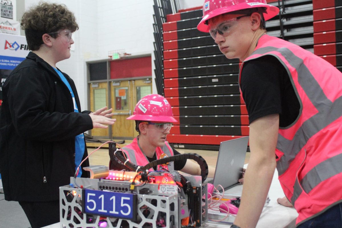 Graden Gentry (12) and Michael Webb (12) work on their robot. "This year specifically, we first started out with, just, digitally designing our robot so we knew what we could do," Webb said. "Camden digitally designed all the robot and tried different things before we completely built it." 