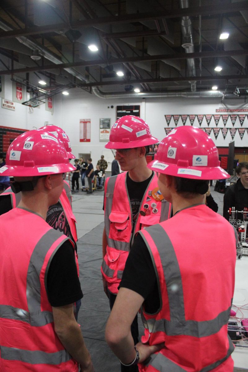 Members of team Escape Velocity discuss their previous match. "Because we only have five of us on our team, instead of like a team with seven, it's harder to get stuff done," Webb said. "Especially earlier on in the season ... so just understanding the boundaries of each person and knowing what they can do, really well."