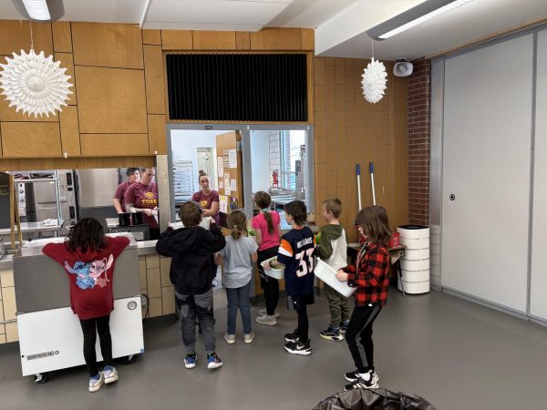 elementary class stands outside cafeteria