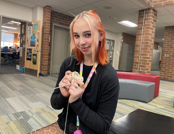 Ace Carson (12) shows off a crochet piece that she is working on. Carson has been crocheting for almost eight years and learned from her mom.