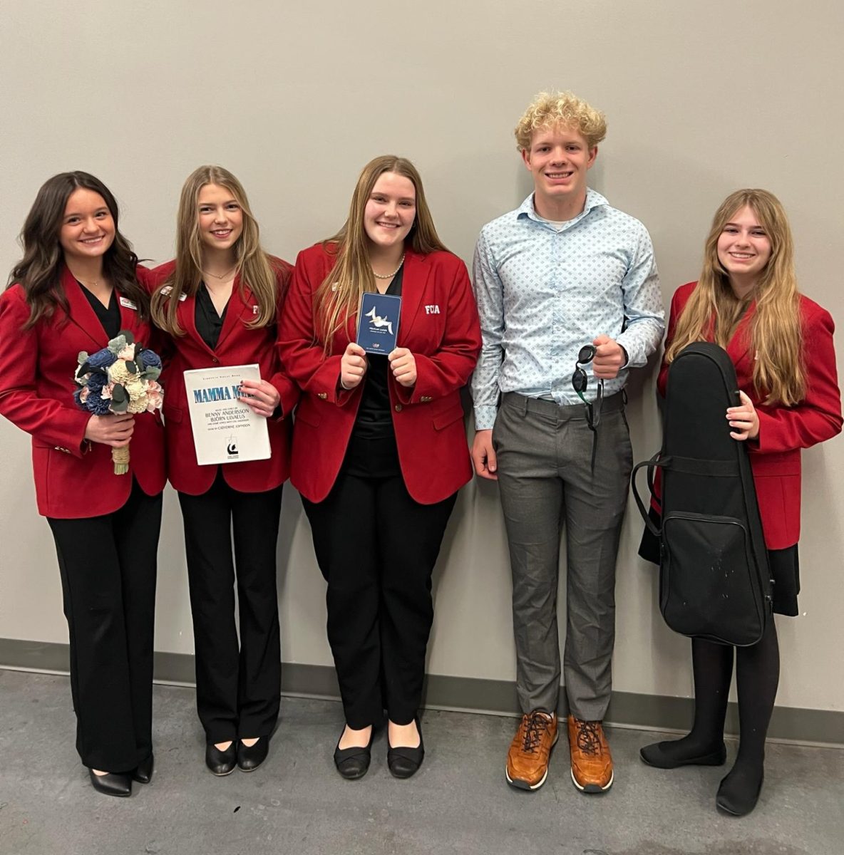 Windsor's five FCCLA district officers pose for a photo with their props. They used these props in a speech and related them to their skills they would bring to the leadership role. (Photo provided by Jessica Teal)