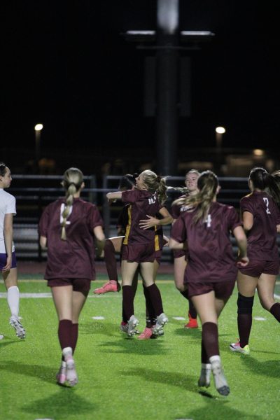 The girls soccer team celebrates their final goal of the night as they secure the victory. The team has split up their goals among every class and consistently scores several goals. 