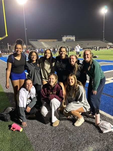 Girls track athletes pose for a photo after racing at a meet in Arizona. The meet was a nationally competitive meet that the team was able to qualify for and compete at. (Photo by Lyndsey Lewis, used with permission)