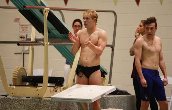 Lucas Penn (11) claps behind the race blocks. Penn has multiple superstitions before races, such as clapping three times while on the blocks. (Photo used with permission from Lucas Penn)