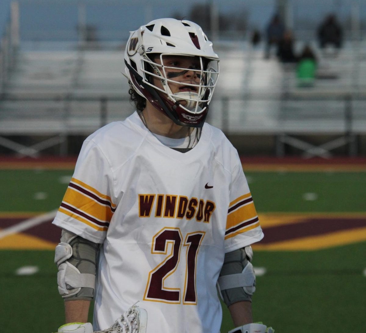 Hayden Williamson (12) walks off the field after a great game. Though WHS lost the game, Williamson scored four points throughout it.